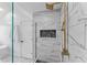 Modern bathroom shower with beautiful white marble tile and gold fixtures at 28 Hudson Bay Ln, Greenwood, IN 46142