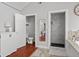 Bathroom featuring tiled walk-in shower, tub, stylish mirror and fixtures at 2919 Macpherson Ave, Indianapolis, IN 46205