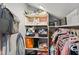 Walk-in closet boasts built-in shelving and ample storage space for organization at 2919 Macpherson Ave, Indianapolis, IN 46205