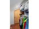 Attic closet features unique door and ample shelving and clothing rods at 2919 Macpherson Ave, Indianapolis, IN 46205