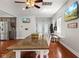 Dining room featuring a large table, hardwood floors, and open access to the kitchen at 2919 Macpherson Ave, Indianapolis, IN 46205