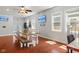 Bright and airy dining room with a large table, bench seating and hardwood floors at 2919 Macpherson Ave, Indianapolis, IN 46205