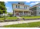 Charming two-story home with a front porch, well-maintained lawn, and welcoming curb appeal at 2919 Macpherson Ave, Indianapolis, IN 46205