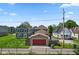 Rear view of a home featuring a garage and fenced yard at 2919 Macpherson Ave, Indianapolis, IN 46205