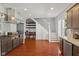 Open living room and staircase with hardwood floors, shelves and study area at 2919 Macpherson Ave, Indianapolis, IN 46205