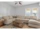 Spacious living room with comfortable sectional seating, hardwood floors, and natural light at 2919 Macpherson Ave, Indianapolis, IN 46205
