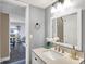 Well-lit bathroom with a modern vanity, elegant mirror, and contemporary fixtures at 3002 Horse Hill W Dr, Indianapolis, IN 46214