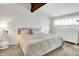 Bright bedroom featuring vaulted ceilings, a large bed, and a dresser at 3002 Horse Hill W Dr, Indianapolis, IN 46214
