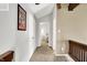 Upstairs hallway with neutral tones, carpeted floors, and access to bedrooms at 3002 Horse Hill W Dr, Indianapolis, IN 46214