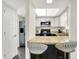 Kitchen with a breakfast bar, updated countertops, stainless steel appliances, and lots of light at 3002 Horse Hill W Dr, Indianapolis, IN 46214