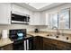 Updated kitchen featuring new appliances, plenty of natural light, and neutral countertops at 3002 Horse Hill W Dr, Indianapolis, IN 46214