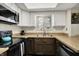 Well-lit kitchen with stainless steel appliances, granite countertops, and ample cabinet storage at 3002 Horse Hill W Dr, Indianapolis, IN 46214