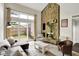 Bright living room featuring a stone fireplace, plush furniture, and sliding glass doors to the backyard at 3002 Horse Hill W Dr, Indianapolis, IN 46214
