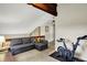 Cozy loft area with comfortable seating, a ceiling fan, and a exercise bike at 3002 Horse Hill W Dr, Indianapolis, IN 46214