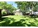 An expansive, well-maintained backyard with lush green grass surrounding the house at 3021 Eastern Ave, Indianapolis, IN 46218