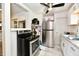 Updated kitchen featuring stainless steel appliances, white cabinets, and modern fixtures at 3021 Eastern Ave, Indianapolis, IN 46218