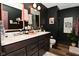 Contemporary bathroom with a double sink vanity, sleek fixtures, and modern decor at 3110 W New York St, Indianapolis, IN 46222