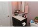Stylish bathroom with decorative towels, modern vanity, and contemporary fixtures at 3110 W New York St, Indianapolis, IN 46222