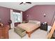 Primary bedroom with decorative ceiling fan and high ceilings at 3110 W New York St, Indianapolis, IN 46222
