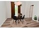 Dining room featuring a modern table with black chairs, warm lighting, and stylish décor at 3110 W New York St, Indianapolis, IN 46222