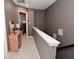 Upstairs hallway with neutral colors, a decorative console table, and access to bedrooms at 3110 W New York St, Indianapolis, IN 46222