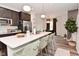 Bright kitchen features an island with barstool seating and pendant lights, creating a sociable atmosphere at 3110 W New York St, Indianapolis, IN 46222