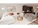 Open living area with modern furniture and seamlessly connects to the kitchen at 3110 W New York St, Indianapolis, IN 46222