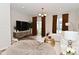 Bright living room with modern furniture, neutral colors, and hardwood flooring at 3110 W New York St, Indianapolis, IN 46222