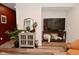 Inviting living space with a stylish console, television, and decor, creating a cozy atmosphere at 3110 W New York St, Indianapolis, IN 46222