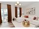 Bright living room with balcony access, modern sofa, and stylish decor at 3110 W New York St, Indianapolis, IN 46222