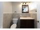 Well-lit half bathroom with modern fixtures and elegant tile at 3216 N Kenwood Ave, Indianapolis, IN 46208