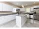 Beautiful kitchen with white cabinets, granite countertops, and a central island at 3216 N Kenwood Ave, Indianapolis, IN 46208