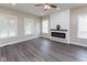 Cozy living room featuring wood floors and an electric fireplace at 3216 N Kenwood Ave, Indianapolis, IN 46208