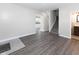 Open-concept living room featuring wood floors, staircase and neutral tones at 3216 N Kenwood Ave, Indianapolis, IN 46208