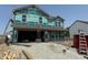 Two-story home under construction with visible framing and protective wrap, showcasing its new construction status at 3321 Godby Dr, Sheridan, IN 46069