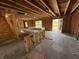 Open-concept interior under construction featuring exposed beams, stud walls, and a staircase, revealing the home's framework at 3321 Godby Dr, Sheridan, IN 46069