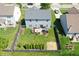 Aerial view of home featuring a fenced backyard, a deck with seating, and lush green lawn at 3341 Enclave Xing, Greenwood, IN 46143