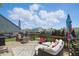 Spacious backyard deck featuring comfortable outdoor seating and an umbrella for shade, perfect for relaxing at 3341 Enclave Xing, Greenwood, IN 46143