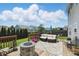 Inviting backyard deck with a modern fire pit, comfortable seating, and well-maintained landscaping at 3341 Enclave Xing, Greenwood, IN 46143