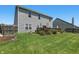 Spacious backyard with a wooden deck, well-maintained lawn, and a secure wooden fence at 3341 Enclave Xing, Greenwood, IN 46143