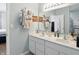 Bathroom with double sink vanity, large mirror, and plenty of storage at 3341 Enclave Xing, Greenwood, IN 46143