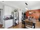 Open-concept eat-in kitchen connects to dining room; features stainless refrigerator at 3341 Enclave Xing, Greenwood, IN 46143