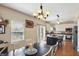 Bright eat-in kitchen features a breakfast bar, stainless appliances, and a door to the backyard at 3341 Enclave Xing, Greenwood, IN 46143
