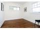 Bright bedroom with hardwood floors, two windows, and neutral wall color perfect for personalization at 3370 N New Jersey St, Indianapolis, IN 46205
