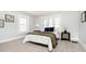 Cozy bedroom featuring plush carpet, two side tables, and a large window for natural light at 3370 N New Jersey St, Indianapolis, IN 46205