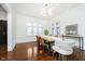 Bright dining area with hardwood floors, unique light fixture, and large windows at 3370 N New Jersey St, Indianapolis, IN 46205