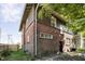 Charming two-story brick home featuring a well-maintained exterior and lush green surroundings at 3370 N New Jersey St, Indianapolis, IN 46205
