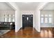 Inviting foyer with hardwood floors and elegant doors, flowing into bright, spacious living areas at 3370 N New Jersey St, Indianapolis, IN 46205