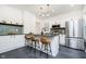 Modern kitchen features stainless steel appliances, sleek countertops, and stylish island seating at 3370 N New Jersey St, Indianapolis, IN 46205