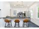 Modern kitchen features stainless steel appliances, sleek countertops, and stylish island seating at 3370 N New Jersey St, Indianapolis, IN 46205